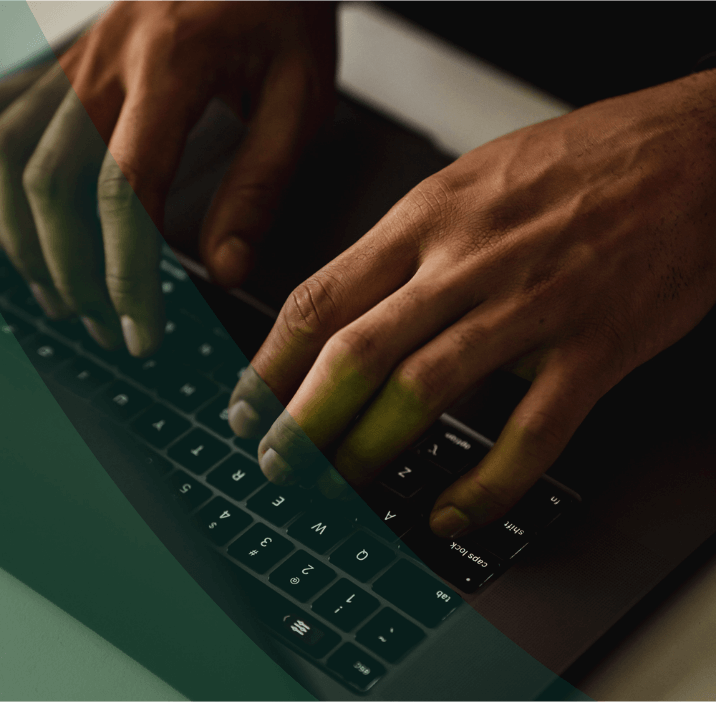 Hands typing on a keyboard